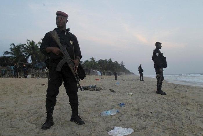 Soldiers stand in guard on the beach in Grand Bassam, Ivory Coast, March 13, 2016. REUTERS/Luc Gnago