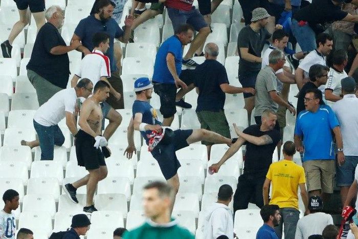Football Soccer - England v Russia - EURO 2016 - Group B - Stade V?lodrome, Marseille, France - 11/6/16 England fans try to escape trouble in the stadium at full time