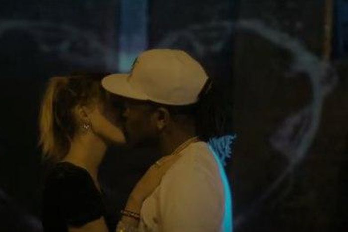 African China and lady sharing a kiss