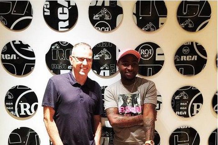 Davido and Peter Edge (Chairman and CEO of RCA Records) after signing the new deal.