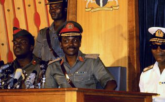 Nigerian Federal Leader Major General Yakubu Gowon (wearing peak cap with red band) addresses a press conference in Lagos, January 22nd. [Getty Images]