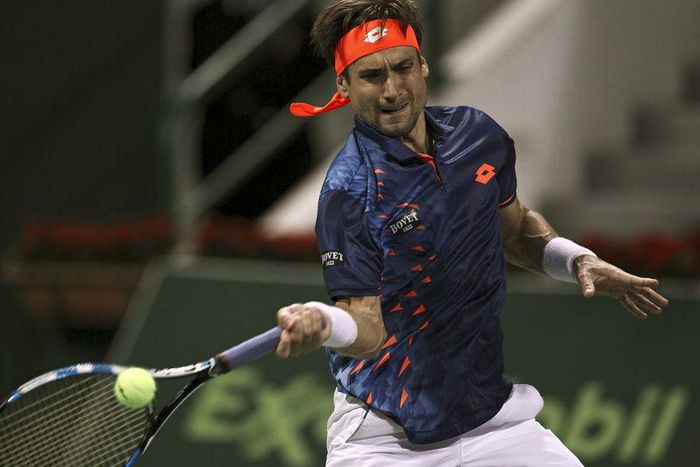 David Ferrer of Spain returns the ball to Illya Marchenko of Ukraine during their Qatar Open men's single tennis match in Doha, Qatar January 5, 2016. REUTERS/Ibraheem Al Omari