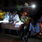Electoral observers listen to and write vote counts at the end of the presidential and legislative elections, in the mostly muslim PK5 neighbourhood of Bangui, Central African Republic, February 14, 2016. REUTERS/Siegfried Modola