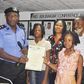 Mr. Owoseni Fatai, presenting the scholarship to the 4 children of the late Mrs Idongesit Ekpo