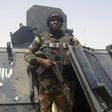 A Cameroonian soldier stands on a Nigerian armoured vehicle used by Boko Haram insurgents to attack a Cameroon army patrol near Waza, February 17, 2015. REUTERS/Bate Felix Tabi Tabe