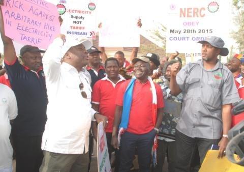 L-R: Chairman NLC Kaduna state comrade Ango Adamu with the general secretary NUTGTWN Comarade Issa Aremu and the chairman TUC Kaduna state comrade Shehu Umar a the picketing by labour and civil society allies of the office of electricity disstribution ...