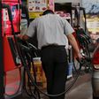 A gas station worker fuels a vehicle in Tokyo August 26, 2015. REUTERS/Toru Hanai