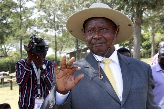 Uganda's incumbent President Yoweri Museveni displays his inked finger after casting his vote at a polling station during the presidential elections in Kirihura in western Uganda, February 18, 2016. REUTERS/James Akena