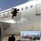 Man on fire sucked out of Somalian plane after explosion