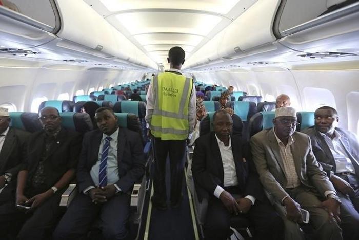 A member of Daallo Airlines ground crew walks down an aisle inside their airline at Aden Abdule International Airport in Somalia's capital Mogadishu in a file photo. REUTERS/Feisal Omar