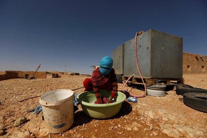 An indigenous Sahrawi woman washes her laundry in a refugee camp of Boudjdour in Tindouf, southern Algeria March 3, 2016. REUTERS/Zohra Bensemra