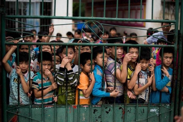 Ten children stabbed outside school gate in southern China