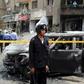 Policemen investigate the site of a car bomb attack on the convoy of Egyptian public prosecutor Hisham Barakat near his house at Heliopolis district in Cairo, Egypt, June 29, 2015. REUTERS/Mohamed Abd El Ghany