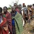 People from Karamojong tribe wait in line to vote at a polling station during elections in a village near the town of Kaabong in Karamoja region, Uganda February 18, 2016. REUTERS/Goran Tomasevic