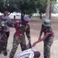 Cadet soldiers torturing a civilian