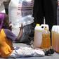 A child drinks water near the monthly food ration at a distribution center in rural Mupinga area in Chiredzi, Zimbabwe, October 6, 2015. REUTERS/Philimon Bulawayo