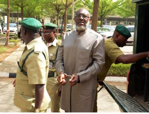Olisa Metuh arrives Abuja court in handcuffs on January 19, 2016.