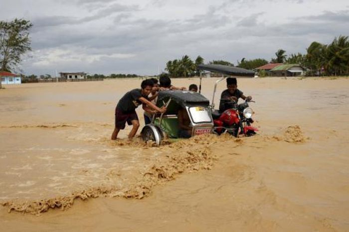 Philippine storm weakens after killing at least nine, leaving thousands stranded