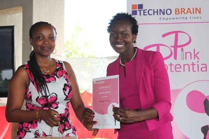 Topyster Muga receiving her award