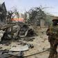 Ugandan soldiers serving in the African Union Mission in Somalia (AMISOM) patrol in a formation near the Jilacow underground cell inside a national security compound after an attack by suspected militants in Mogadishu August 31, 2014. I REUTERS/Feisal ...
