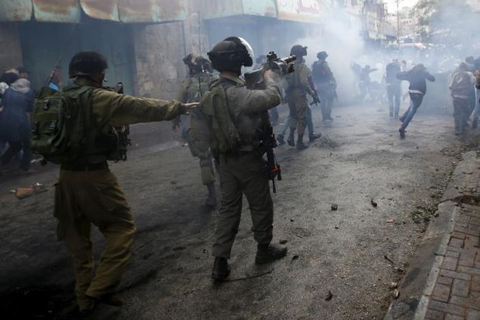 Palestinian shot dead after stabbing Israeli soldier, police say