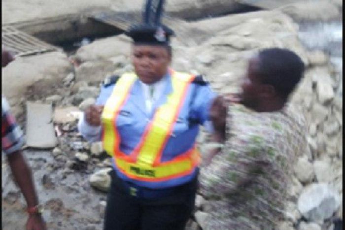 A policewoman dealing with a danfo driver