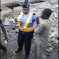 A policewoman dealing with a danfo driver