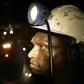 A mine worker looks on underground in Modderfontein east mine, outside Johannesburg, February 3, 2009. REUTERS/Siphiwe Sibeko