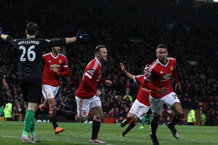 Jesse Lingard and Wayne Rooney celebrate a goal against Stoke City in February, 2016