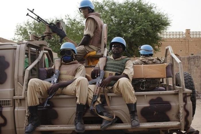 UN peacekeepers from Burkina Faso patrol on election day in Timbuktu July 28, 2013. REUTERS/Joe Penney