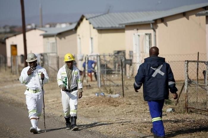 Workers are seen at a hostel in a file photo REUTERS/Siphiwe Sibeko