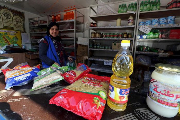 A worker sells subsidized food commodities at a government-run supermarket in Cairo, Egypt, February 14, 2016. REUTERS/Mohamed Abd El Ghany