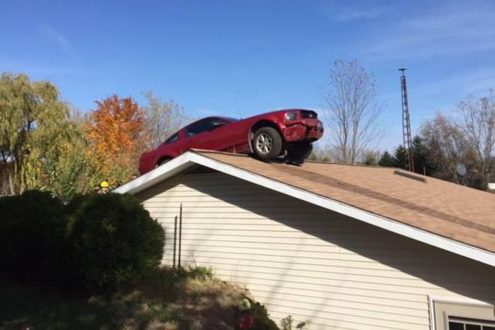 83-year old Woman shocked to find a car parked on the roof of her house