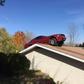 83-year old Woman shocked to find a car parked on the roof of her house