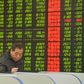 An investor looks at a computer screen showing stock information at a brokerage house in Fuyang, Anhui province, January 28, 2016. REUTERS/China Daily