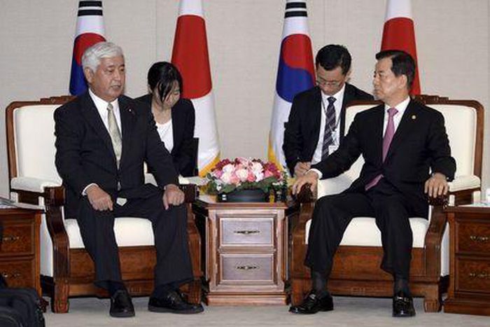 Japan tries to ease South Korea's concern over military role