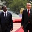 Turkish President Tayyip Erdogan (R) walks with Ivory Coast's President Alassane Ouattara at the presidential palace in Abidjan February 29, 2016. REUTERS/Luc Gnago