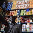 A shopkeeper receives payment in a roadside kiosk in Senegal's capital Dakar, file. REUTERS/Ricci Shryock/Files