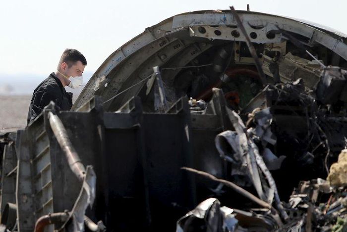 A military investigator from Russia stands near the debris of a Russian airliner at its crash site at the Hassana area in Arish city, north Egypt, November 1, 2015. REUTERS/Mohamed Abd El Ghany