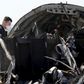 A military investigator from Russia stands near the debris of a Russian airliner at its crash site at the Hassana area in Arish city, north Egypt, November 1, 2015. REUTERS/Mohamed Abd El Ghany