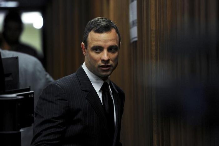 South African Olympic and Paralympic sprinter Oscar Pistorius arrives in court for his trial in Pretoria July 2, 2014. REUTERS/Werner Beukes/Pool