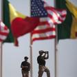 American security officers scan the airport from a rooftop below Senegalese and American flags before the departure of U.S. President Barack Obama in Dakar, Senegal, June 28, 2013. REUTERS/Joe Penney
