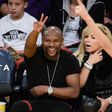 Floyd Mayweather  watching a basket ball game between the Golden State Warriors and the LA Laker