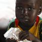 A refugee child from South Sudan feeds on food supplements at a health centre at the Kule refugee camp in Ethiopia's Gambella region, April 1, 2015. . REUTERS/Thomas Mukoya