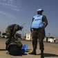 Ghanian U.N. peacekeepers wait for a bus upon arriving in Juba February 28, 2014. REUTERS/Andreea Campeanu