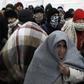 Migrants wait in line inside a registration camp in Presevo, Serbia, January 20, 2016. REUTERS/Marko Djurica