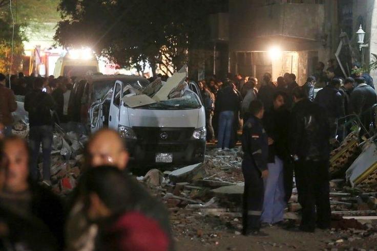 Damaged cars are seen at the scene of a bomb blast in Giza, Egypt, January 21, 2016. A bomb attack killed six people, including three policemen, on Thursday near a road leading to the pyramids in the Cairo suburb of Giza, security sources said. REUTERS...