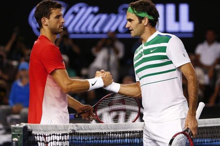 Switzerland's Roger Federer (R) shakes hands with Bulgaria's Grigor Dimitrov after Federer won their third round match at the Australian Open tennis tournament at Melbourne Park, Australia, January 22, 2016. REUTERS/Jason O'Brien