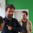 British photojournalist Phil Moore (R) and French journalist Jean Philippe Remy meet French embassy staff in the hallway outside the Prosecutor's office in Burundi's capital Bujumbura, January 29, 2016. REUTERS/Jean Pierre Aime Harerimana