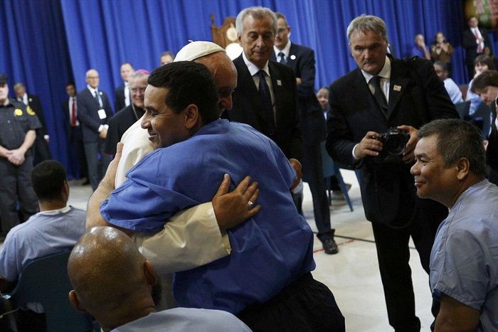 Pope hugs Mexico prisoners, warns businesses on slave labour